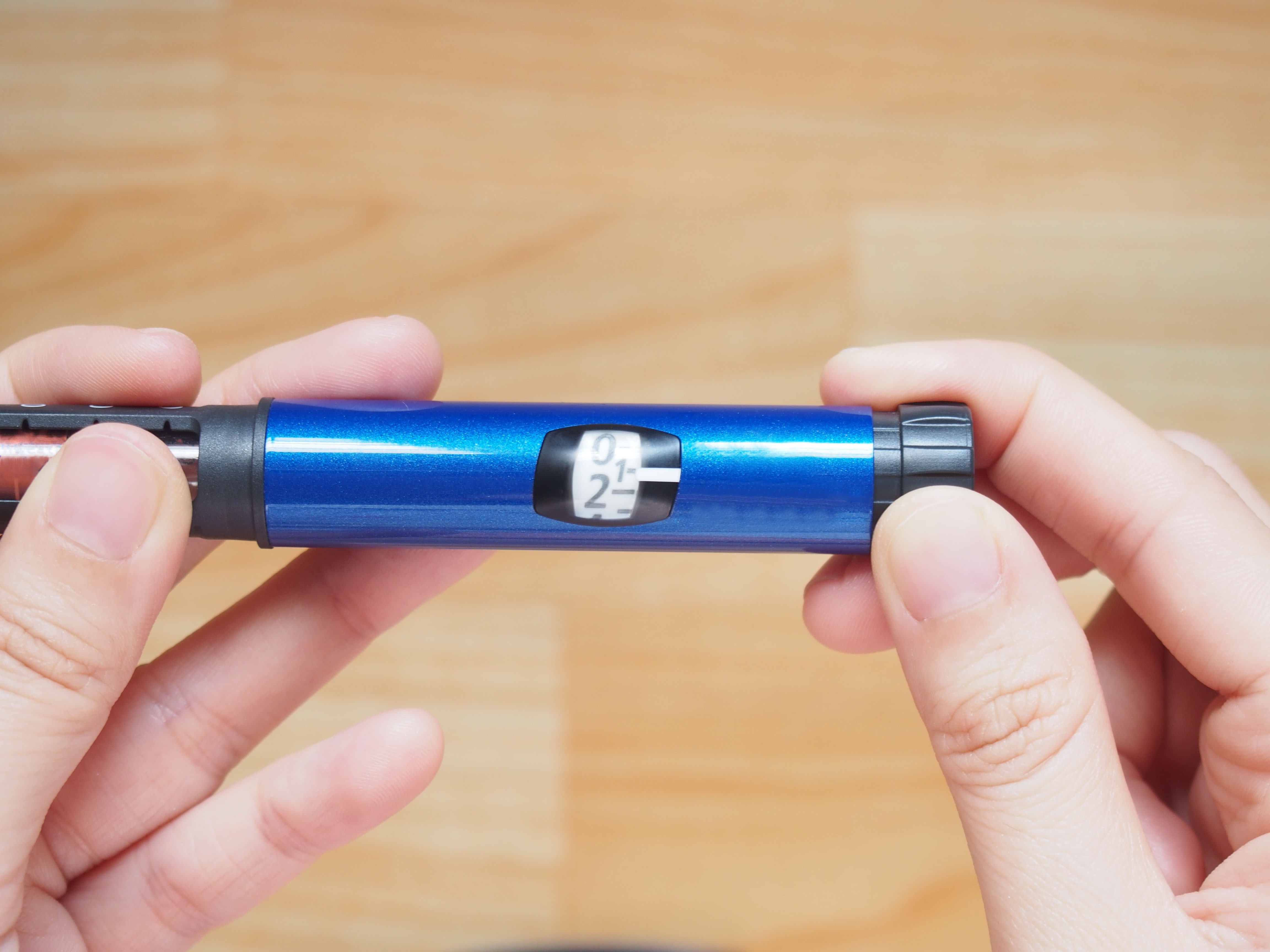 Hands holding insulin pen