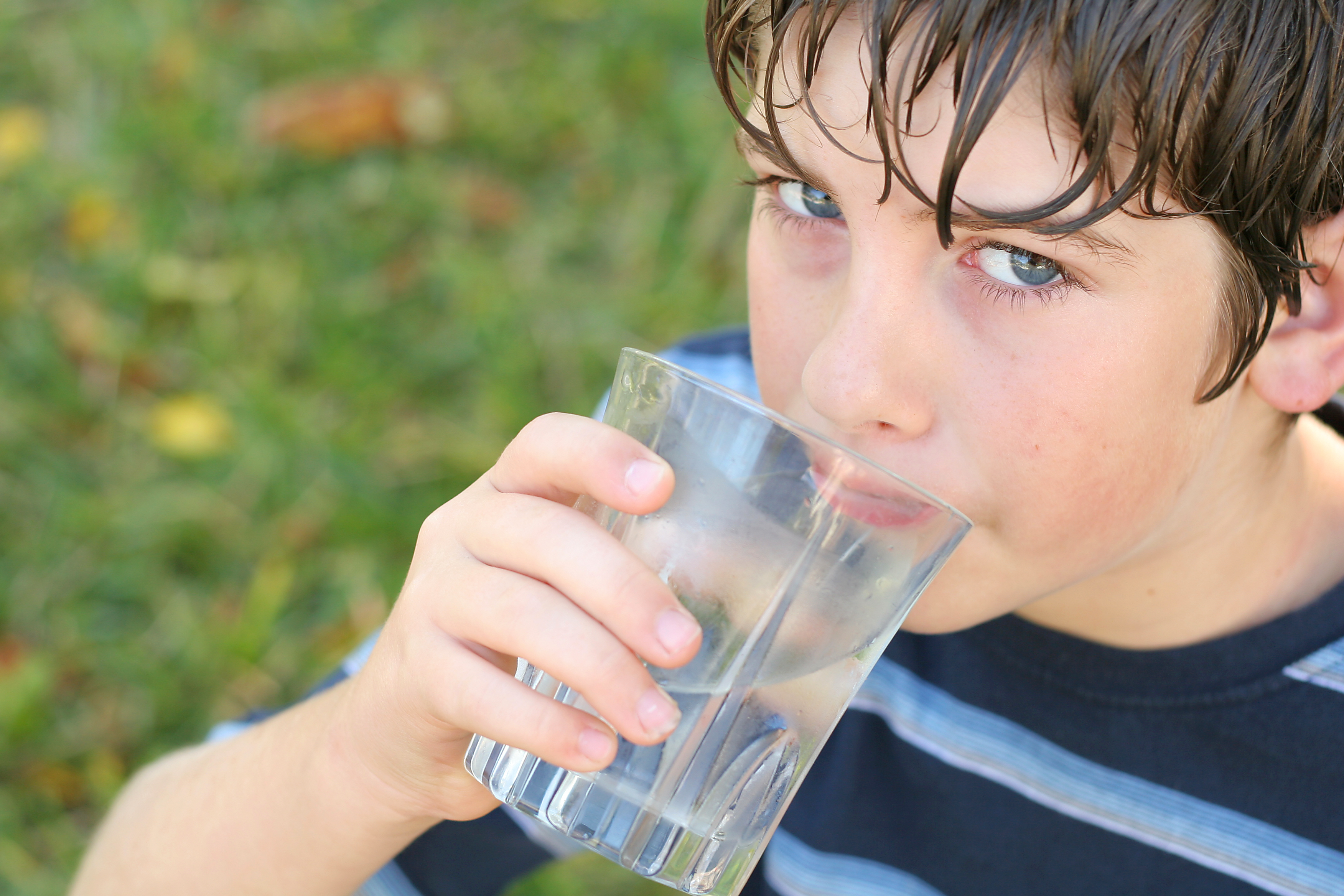 Boy drinking glass of water