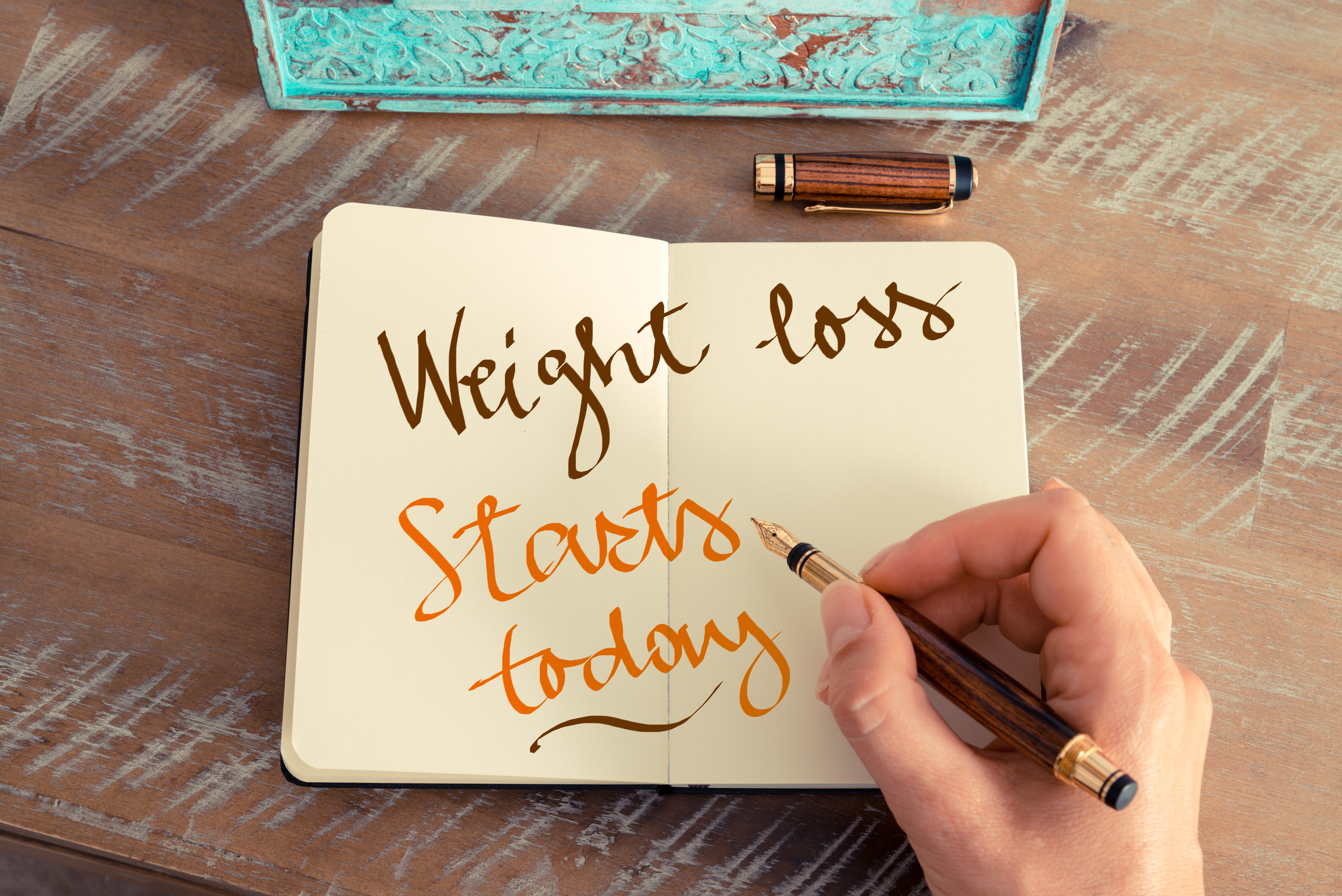 Weight loss starts here written in a diary