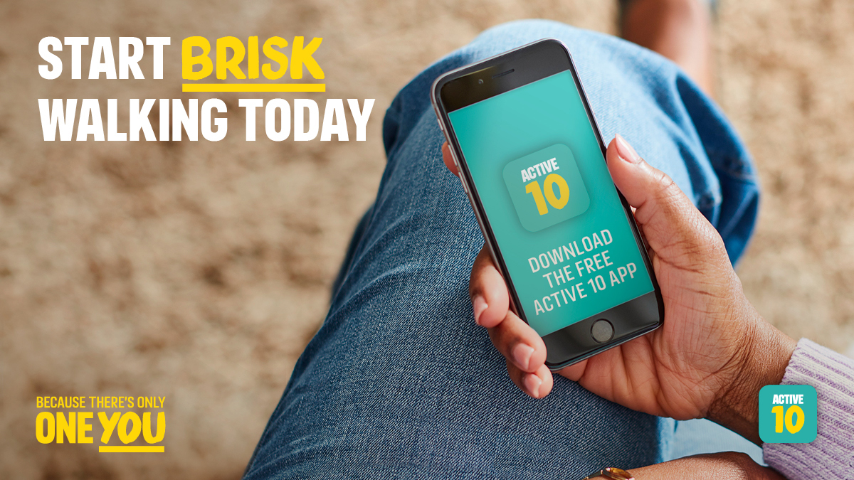 Leg with phone held infront of it. Start brisk walking today