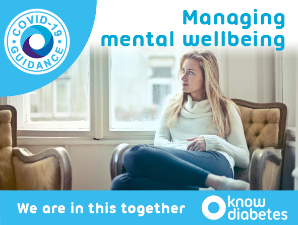 Woman sitting on chair looking out the window