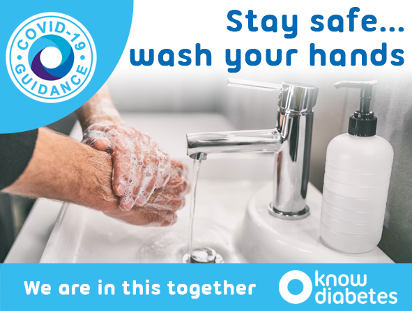 Person washing hands in sink